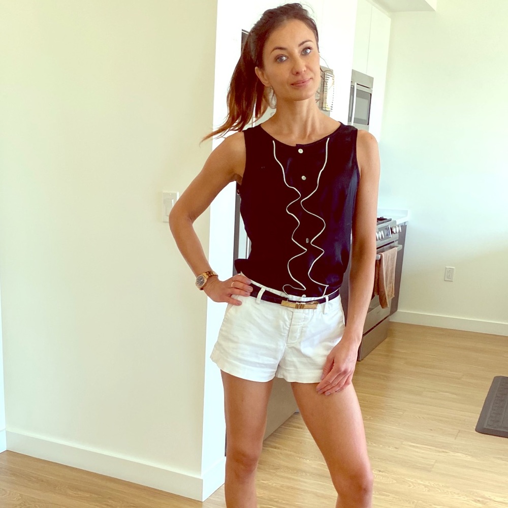 Black button down sleeveless blouse